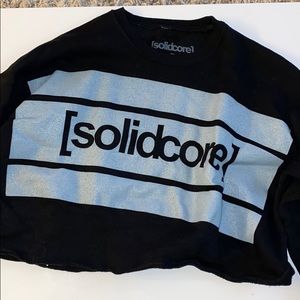 Cropped black sweatshirt with [solidcore] logo
